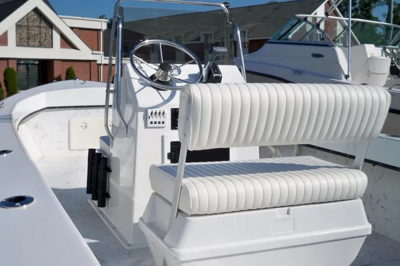 Slide: The Image of 2026 C-Hawk 200 Center Console boat, viewed from the stern under bright sunlight. - 4