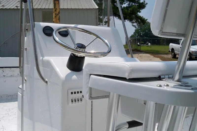 Slide: The Image of 2026 C-Hawk 200 Center Console boat interior with steering wheel and controls. - 5