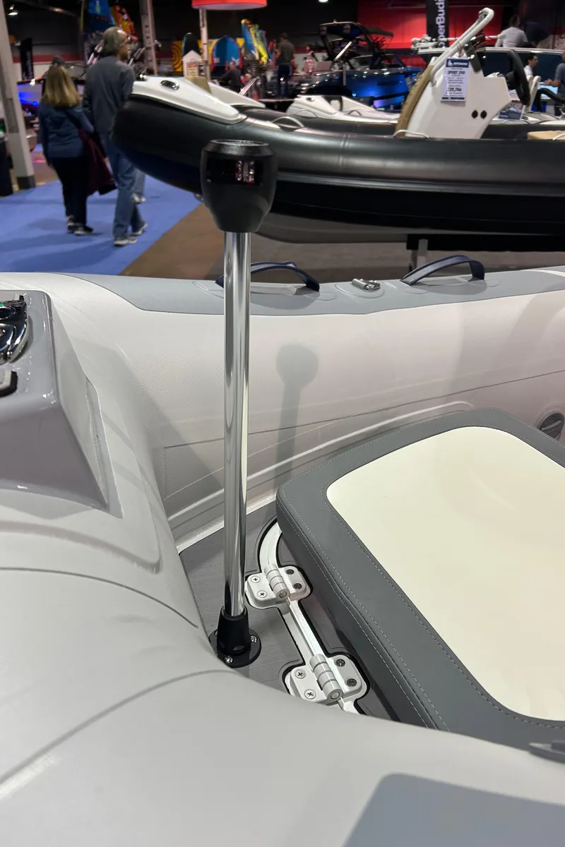 Slide: The Image of 2025 Highfield Classic 310 FCT boat interior with steering wheel and seating detail. - 10