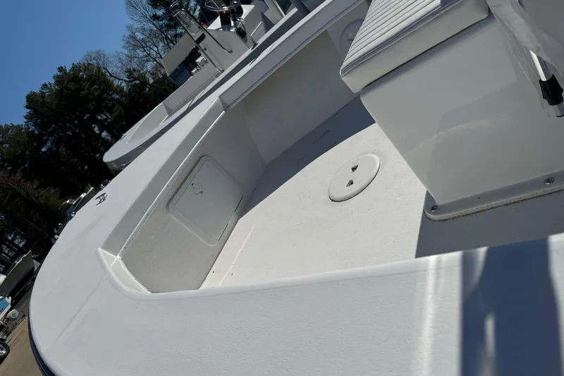 Slide: The Image of 2026 C-Hawk 18 Center Console boat interior with seating and storage compartments. - 11