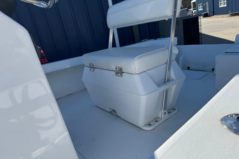 Slide: The Image of 2026 C-Hawk 18 Center Console boat interior with white seating and storage. - 13