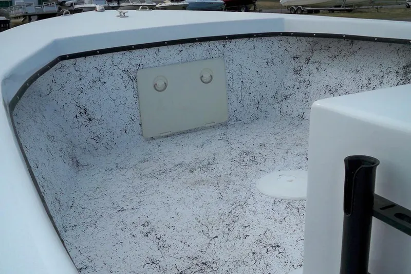 Slide: The Image of 2026 C-Hawk 18 Center Console boat with frosty deck and seating area. - 3