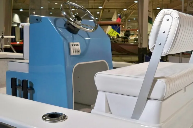 Slide: The Image of 2026 C-Hawk 18 Center Console boat interior with white seating and console. - 4