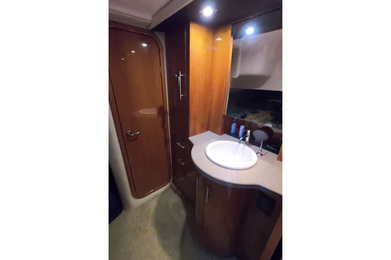 Slide: The Image of Luxurious bathroom interior of 2011 Regal 42 Sport Coupe yacht with wooden cabinetry. - 11
