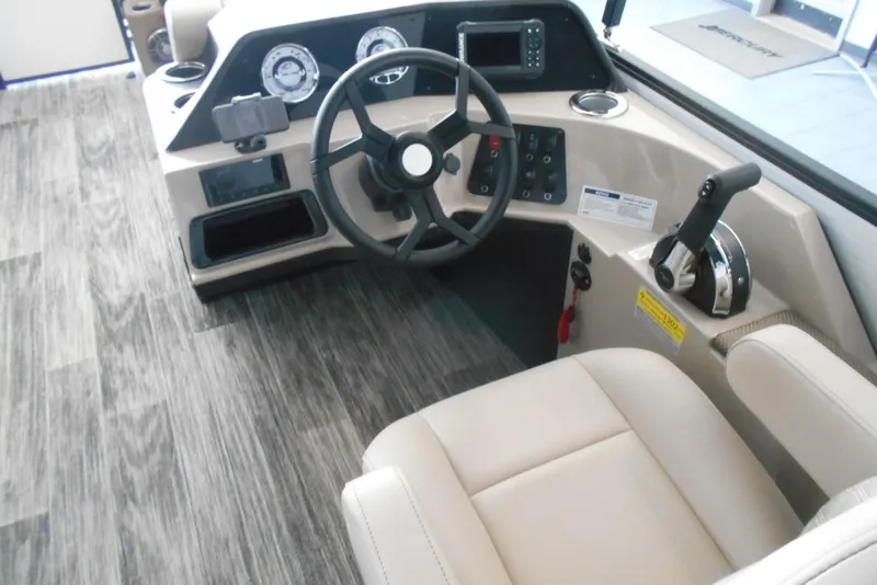 Slide: The Image of 2025 Crest Classic LX 200 SLC boat interior with steering wheel and control panel. - 13