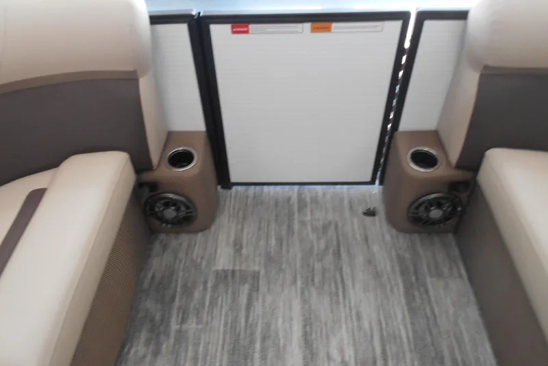 Slide: The Image of Interior of 2025 Crest Classic LX 200 SLC boat with seating and cup holders. - 16