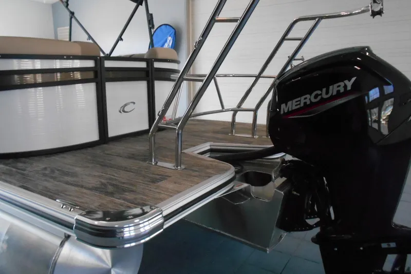 Slide: The Image of 2025 Crest Classic LX 200 SLC pontoon boat with Mercury outboard motor. - 5