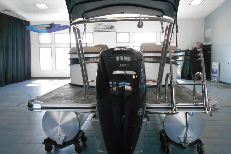 Slide: The Image of 2025 Crest Classic LX 200 SLC pontoon boat with Mercury 115 engine in showroom. - 6