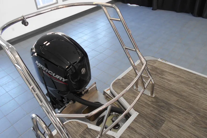 Slide: The Image of 2025 Crest Classic LX 200 SLC boat with Mercury outboard motor and stainless steel railing. - 7