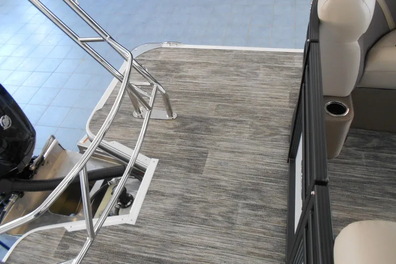 Slide: The Image of 2025 Crest Classic LX 200 SLC boat interior with modern flooring and seating. - 8