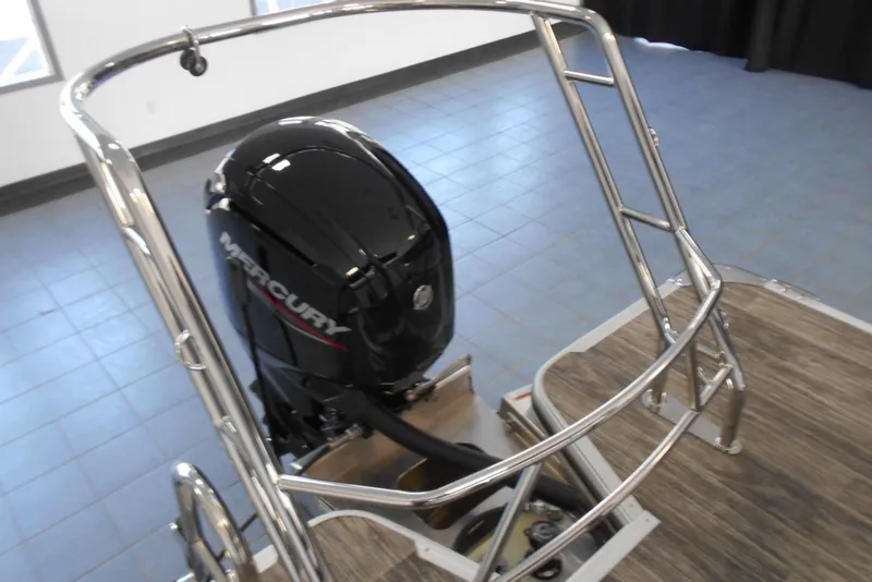 Slide: The Image of 2025 Crest Classic LX 200 SLC boat with Mercury outboard motor, stainless steel railing. - 9