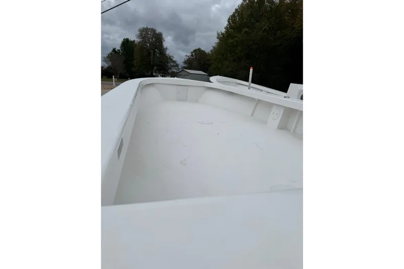 Slide: The Image of 2026 C-Hawk 26 Center Console boat deck under cloudy sky. - 6