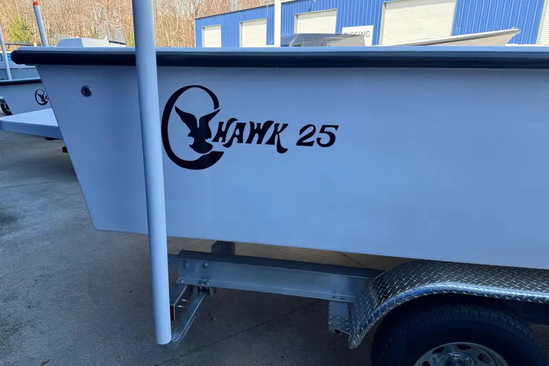 Slide: The Image of 2026 C-Hawk 25 Center Console boat on trailer, side view. - 8
