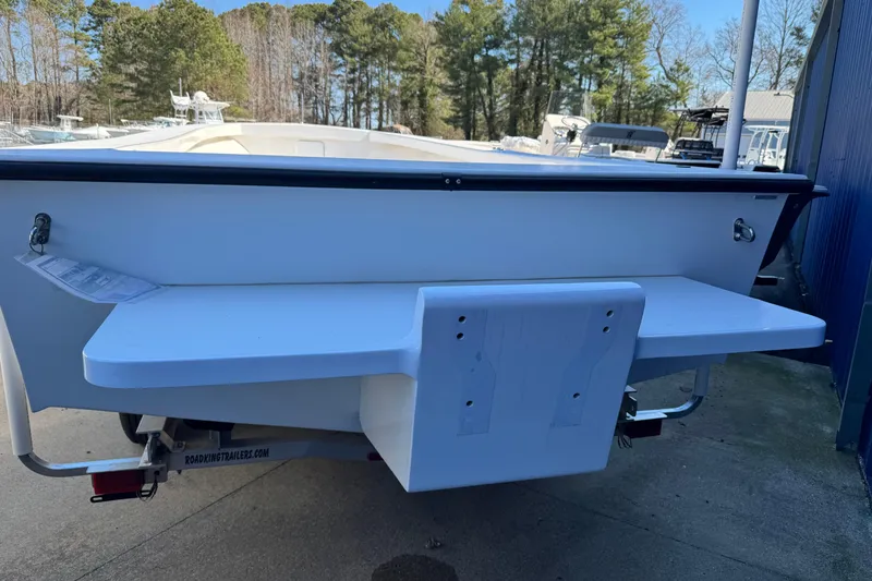 Slide: The Image of 2026 C-Hawk 25 Center Console boat rear view with swim platform and ladder. - 9