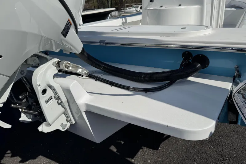 Slide: The Image of 2026 C-Hawk 23 Center Console boat engine and transom detail. - 10