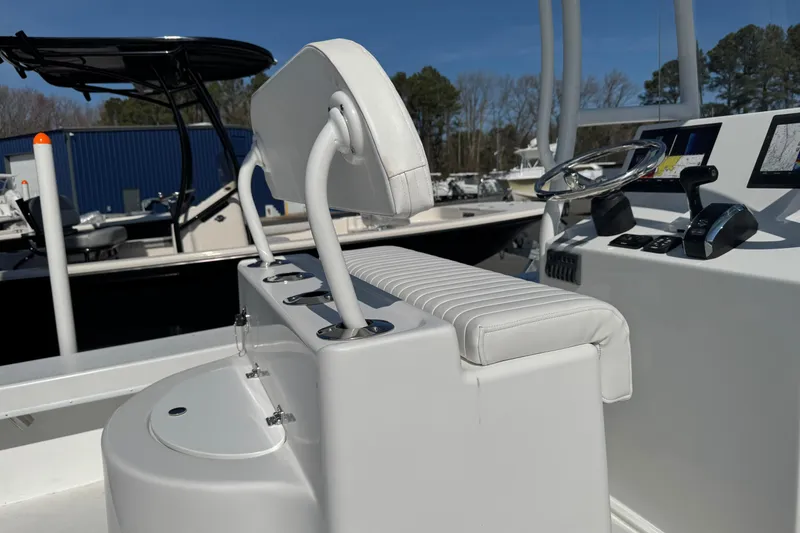Slide: The Image of 2026 C-Hawk 23 Center Console boat interior with steering wheel and seating. - 13