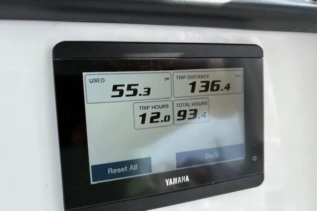 Slide: The Image of Yamaha display showing trip data on 2022 Edgewater 230CC boat: fuel, distance, hours. - 5