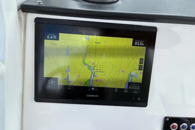 Slide: The Image of Garmin navigation display on 2022 Edgewater 230CC boat dashboard. - 6