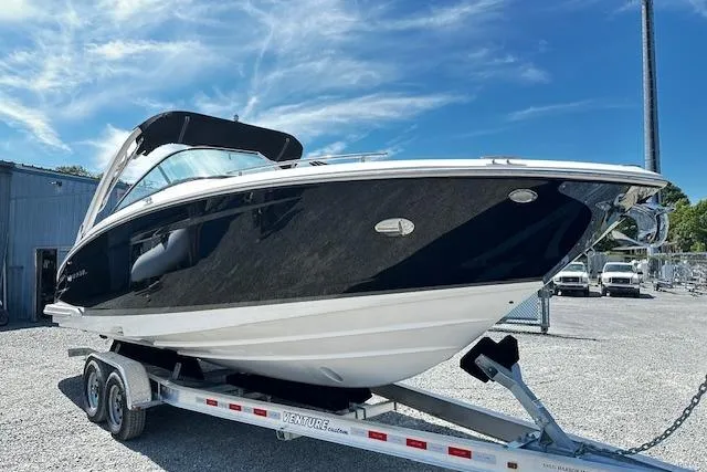 The Image of 2016 Regal 2800 Bowrider boat on trailer under blue sky. - 0