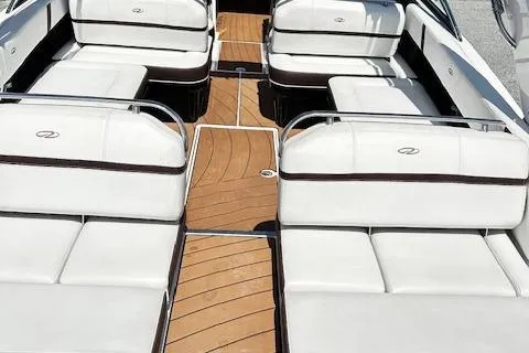 Slide: The Image of 2016 Regal 2800 Bowrider interior with white seating and wooden flooring. - 12