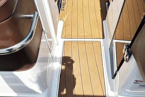 Slide: The Image of 2016 Regal 2800 Bowrider boat interior with teak flooring and seating. - 20