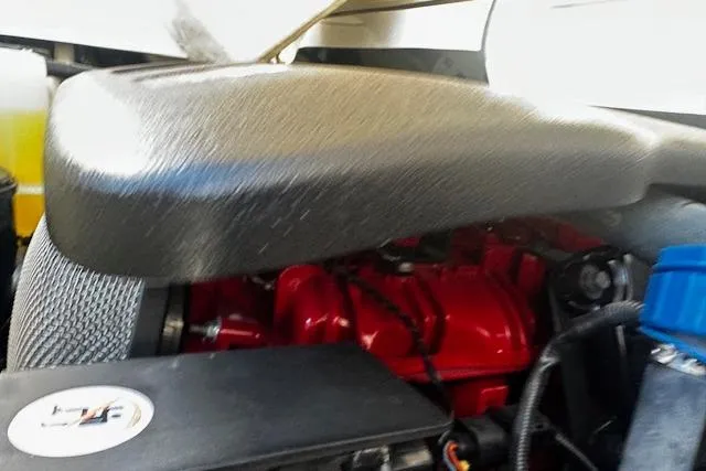 Slide: The Image of Engine compartment of a 2016 Regal 2800 Bowrider boat, showcasing components and wiring. - 24