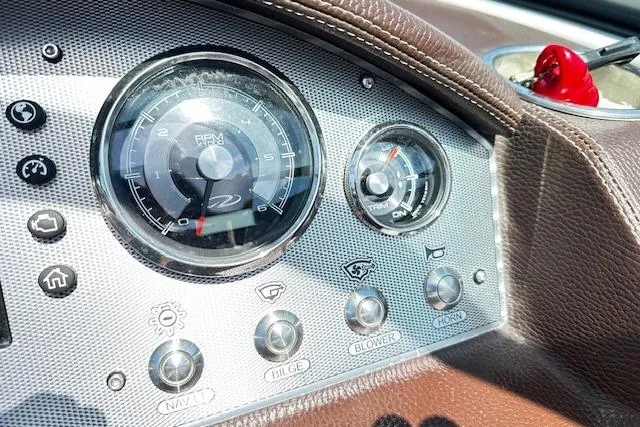 Slide: The Image of Dashboard of a 2016 Regal 2800 Bowrider boat with gauges and control buttons. - 6