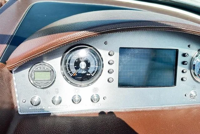 Slide: The Image of Dashboard of 2016 Regal 2800 Bowrider boat with gauges and controls. - 7