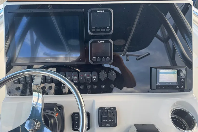 Slide: The Image of Dashboard of 2026 Bulls Bay 255 boat with Garmin and Suzuki displays. - 14