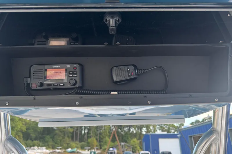 Slide: The Image of 2026 Bulls Bay 255 boat with Garmin marine radio and microphone in storage compartment. - 15