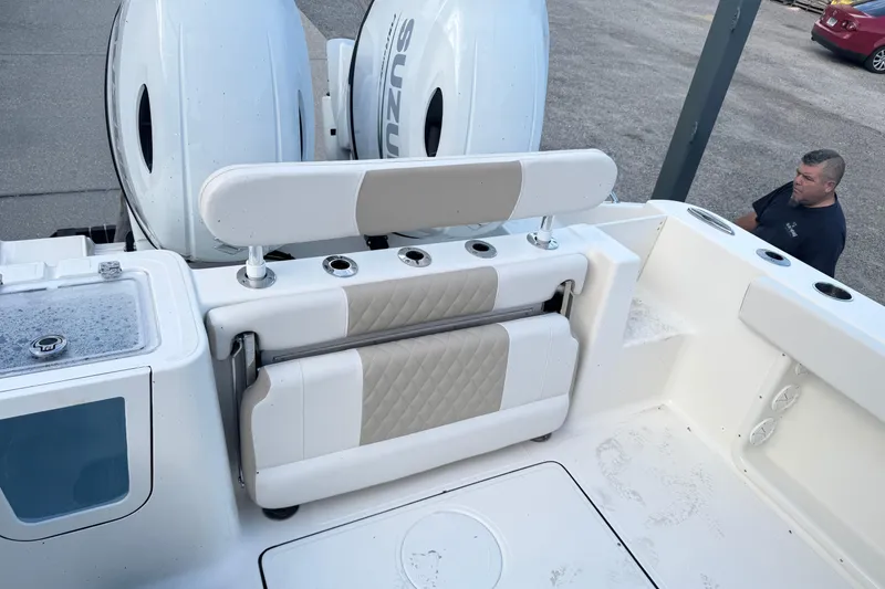 Slide: The Image of 2026 Bulls Bay 255 boat with Suzuki engines, featuring a foldable seat and rod holders. - 19