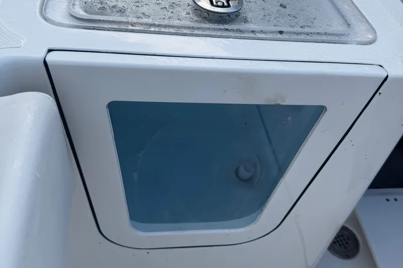 Slide: The Image of Bulls Bay 255 boat compartment with a transparent window, 2026 model. - 21