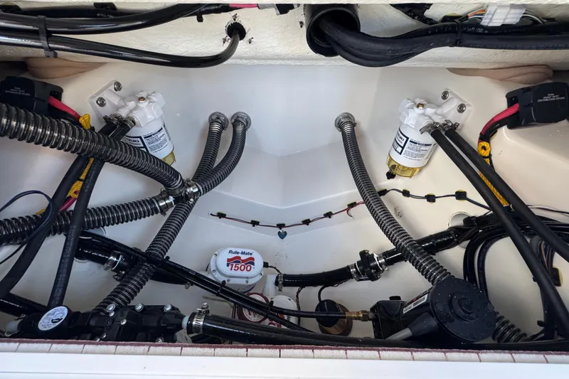 Slide: The Image of Bilge area of 2026 Bulls Bay 255 boat with pumps and wiring. - 22