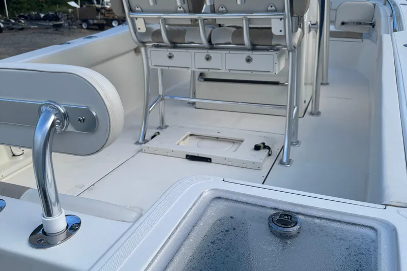 Slide: The Image of 2026 Bulls Bay 255 boat interior with seating and storage compartments. - 5