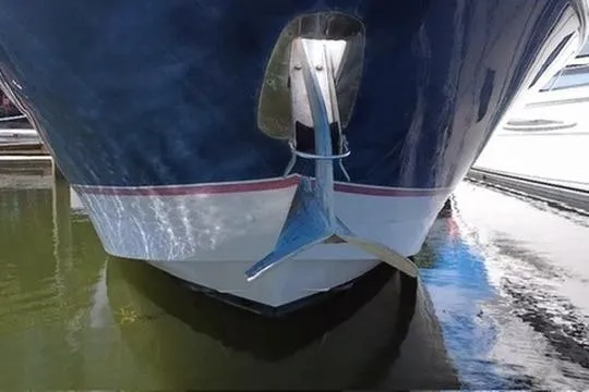Slide: The Image of Front view of 2006 Larson Cabrio 370 boat with anchor in water. - 111