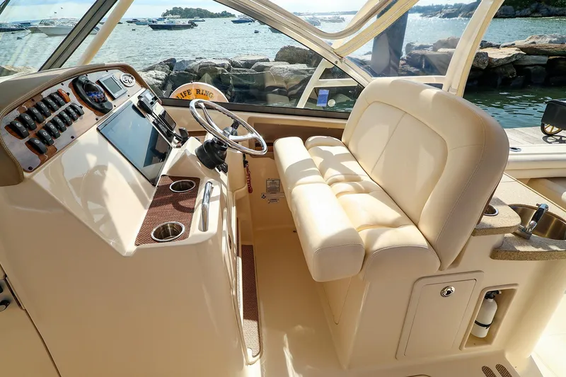 Slide: The Image of 2015 Grady White 335 Freedom boat interior with helm, seating, and ocean view. - 15