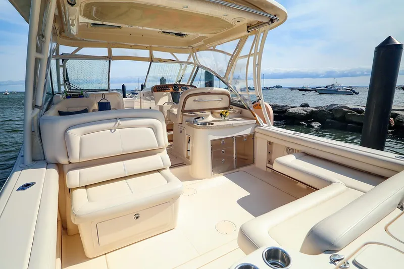 Slide: The Image of 2015 Grady White 335 Freedom boat interior with luxurious seating and ocean view. - 22