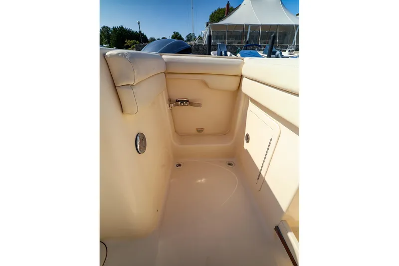 Slide: The Image of Interior view of 2015 Grady White 335 Freedom boat, showcasing seating and storage. - 23