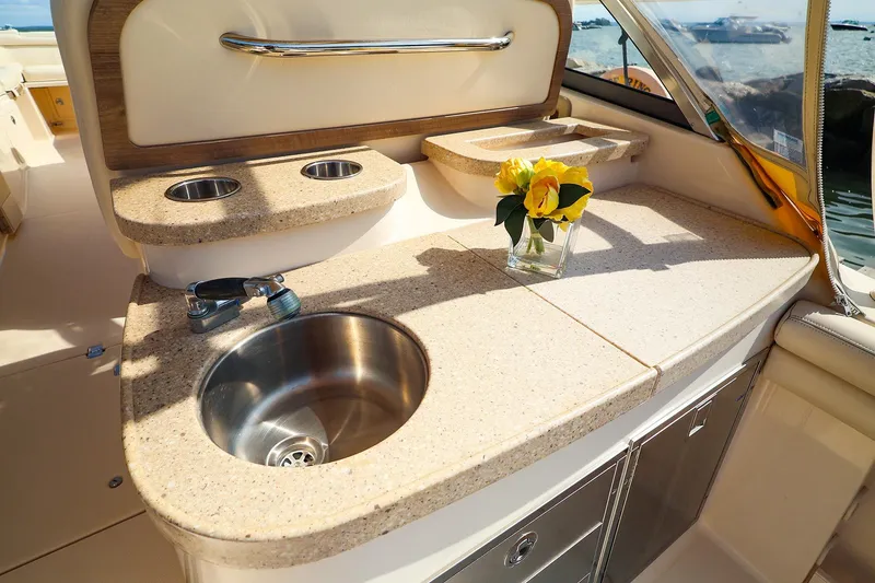 Slide: The Image of Luxury boat interior with sink and countertop on 2015 Grady White 335 Freedom. - 25