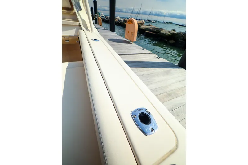 Slide: The Image of 2015 Grady White 335 Freedom boat docked by the water. - 30