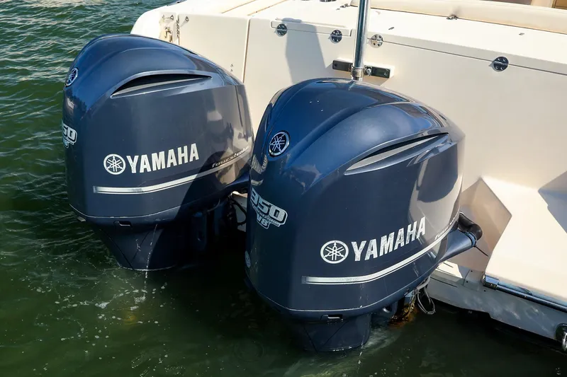 Slide: The Image of Twin Yamaha outboard engines on a 2015 Grady White 335 Freedom boat. - 37