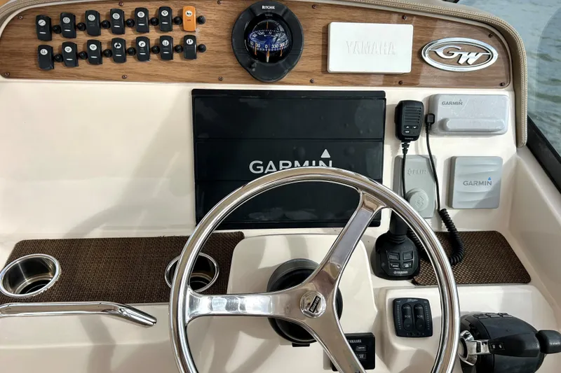 Slide: The Image of Dashboard of a 2015 Grady White 335 Freedom boat with Garmin navigation. - 8