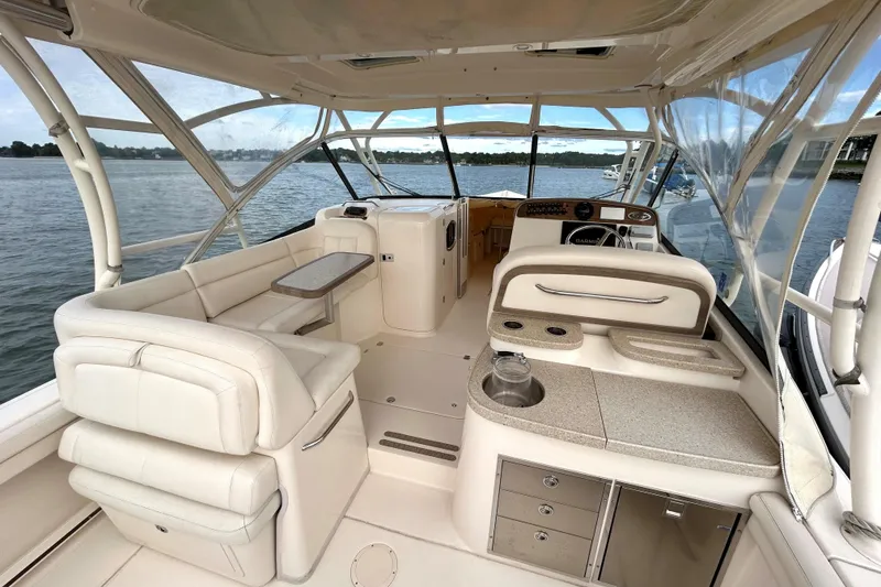 Slide: The Image of Interior of 2015 Grady White 335 Freedom boat with seating and helm, on the water. - 9