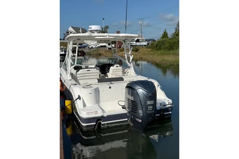 Slide: The Image of 2022 Robalo R247 Dual Console boat with Yamaha 300 V6 engine on calm water. - 13