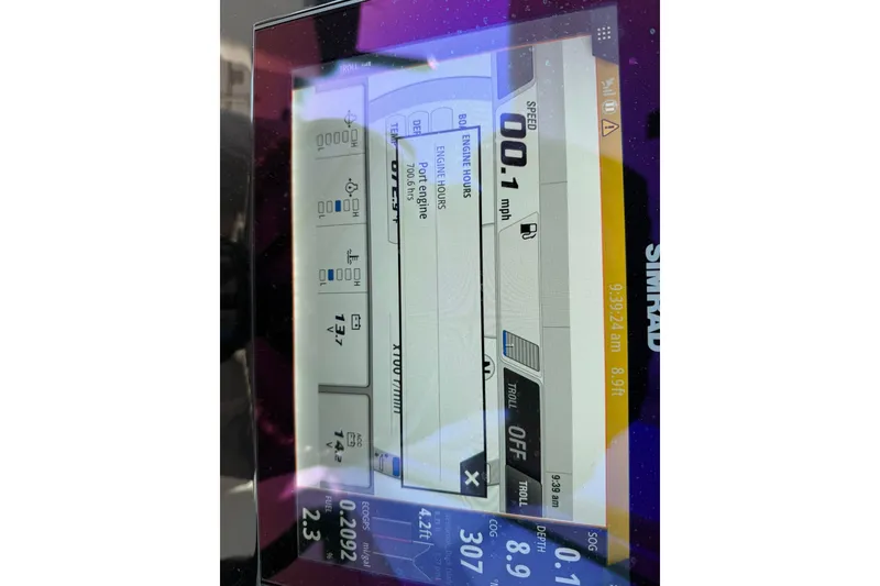 Slide: The Image of Simrad display on 2022 Robalo R247 Dual Console showing speed, engine hours, and depth. - 14