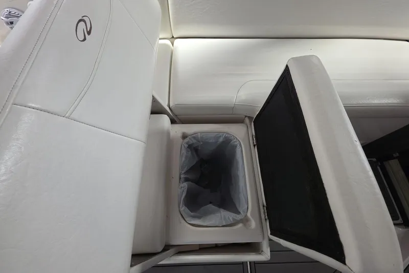 Slide: The Image of White leather seating with built-in storage on a 2007 Regal 2860 Window Express boat. - 10