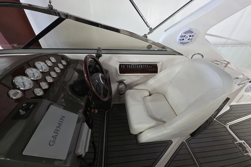 Slide: The Image of 2007 Regal 2860 Window Express helm with Garmin navigation and white captain's chair. - 13