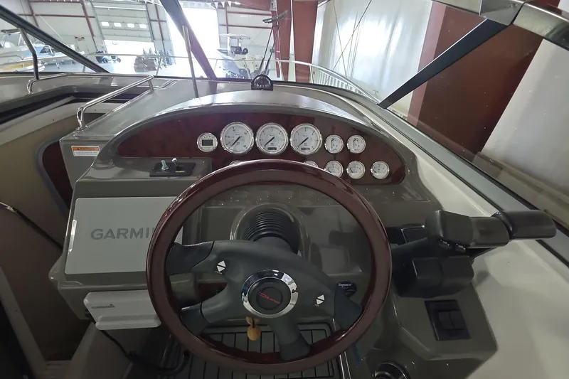 Slide: The Image of 2007 Regal 2860 Window Express boat dashboard with Garmin navigation and gauges. - 14