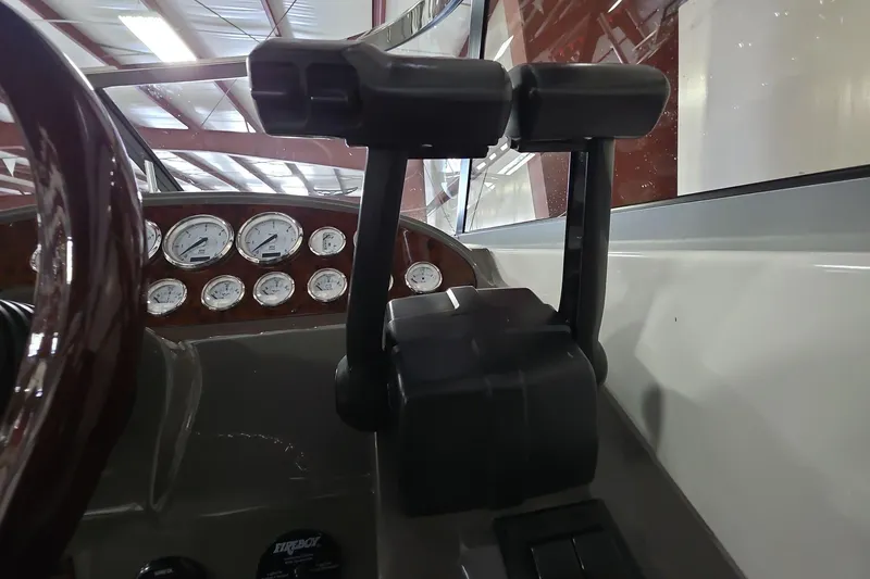 Slide: The Image of 2007 Regal 2860 Window Express boat dashboard with gauges and controls. - 15