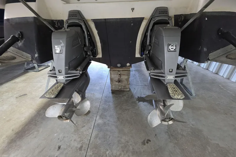 Slide: The Image of 2007 Regal 2860 Window Express boat with dual Volvo Penta outdrives in a garage. - 3